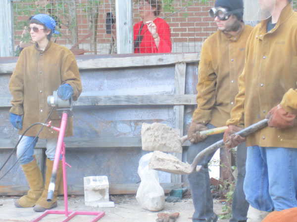 Students ready to bury fire under sand